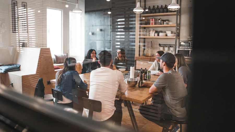 A meeting seen through a glass-walled office