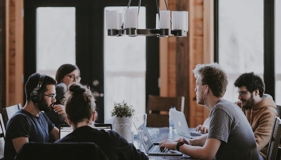 Colleagues in discussion in a bright workspace