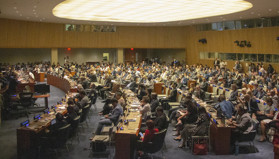 Delegates filling a summit assembly hall